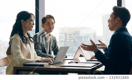Group of casual business people meeting in an office 132931880