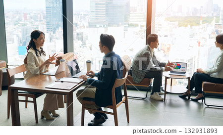 A group of casual business people meeting in a lobby 132931893