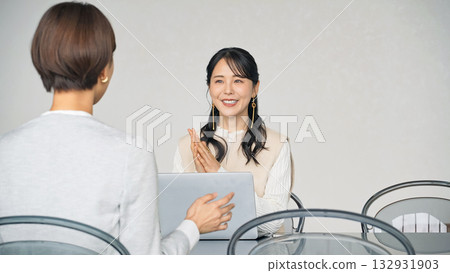 A group of women meeting in the lobby A group of women meeting in the lobby 132931903