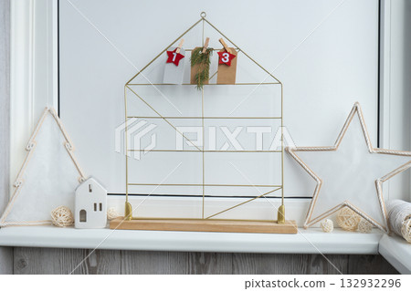 Number on craft paper notes with tasks before Christmas holidays. Female making kraft paper for handmade advent calendar Made with your own hands step by step DIY Number on craft paper notes with tasks before Christmas holidays. Female making kraft paper for handmade advent calendar Made with your own hands step by step DIY 132932296