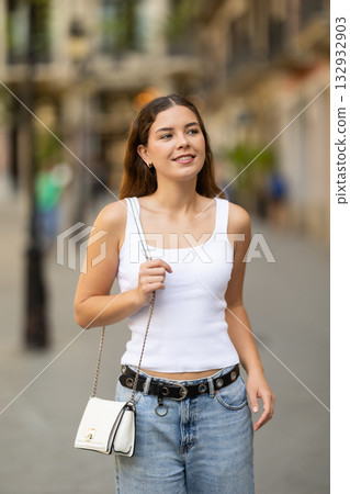 Young female tourist exploring city on sunny day 132932903