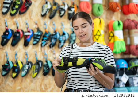 Girl choose summer shoes for hiking 132932912