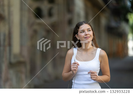 Young female tourist exploring city on sunny day 132933228