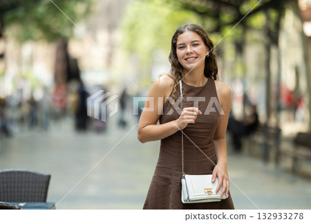 Young woman walking around summer european city Young woman walking around summer european city 132933278