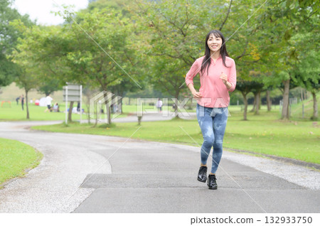 A woman running a park 132933750