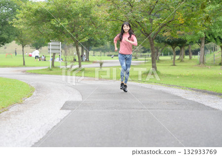 A woman running a park 132933769