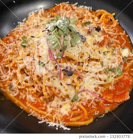 Creamy spaghetti carbonara made with rich egg yolk sauce, crispy bacon, parmesan cheese, and freshly ground black pepper for a classic, indulgent Italian pasta dish. 132933778