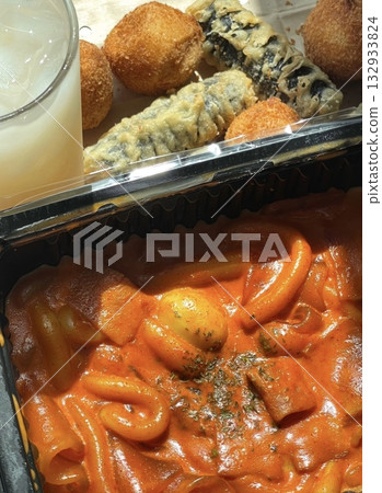Spicy tteokbokki with chewy rice cakes in a rich, flavorful sauce, paired with crispy twigim for the perfect Korean street food combo. A delicious mix of spicy, crunchy, and savory flavors! Spicy tteokbokki with chewy rice cakes in a rich, flavorful sauce, paired with crispy twigim for the perfect Korean street food combo. A delicious mix of spicy, crunchy, and savory flavors! 132933824