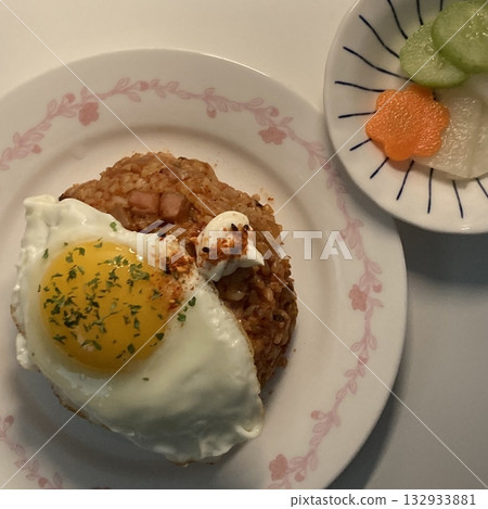 nasi goreng or fried rice traditional frying rice dish from indonesia made of Precooked rice fried in a small amount of oil, then spiced up with shallots, garlic, chili and sweet soy sauce. nasi goreng or fried rice traditional frying rice dish from indonesia made of Precooked rice fried in a small amount of oil, then spiced up with shallots, garlic, chili and sweet soy sauce. 132933881