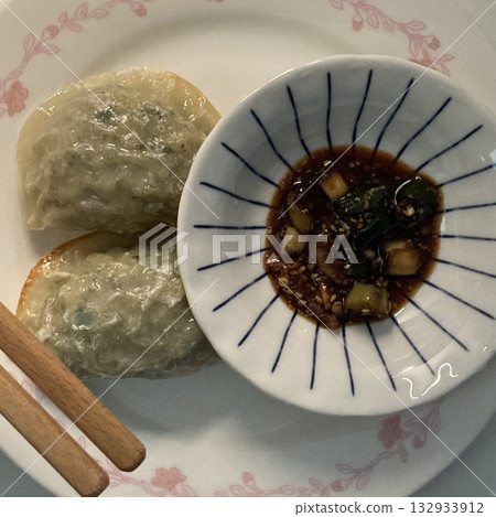 Korean dumplings filled with a mix of savory ingredients like ground meat, tofu, and vegetables. Mandu can be steamed, boiled, or pan-fried, making it a versatile and delicious snack or meal. Korean dumplings filled with a mix of savory ingredients like ground meat, tofu, and vegetables. Mandu can be steamed, boiled, or pan-fried, making it a versatile and delicious snack or meal. 132933912