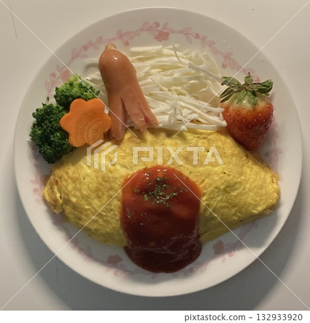 Fluffy omurice filled with savory fried rice topped with a soft omelet, paired with juicy, flavorful meatballs. A perfect combination of comfort and heartiness in every satisfying bite. 132933920