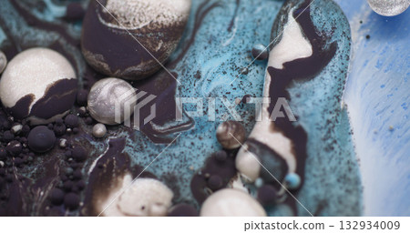 Drop flow. Color liquid. Defocused blue white purple ink water oil bubbles pigment round acrylic floating on abstract art background. 132934009