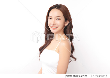 A beautiful young Asian woman with clean, fresh skin against a white background. Skincare, facial treatment, cosmetology, beauty, and spa. An elegant portrait of an Asian woman. A beautiful young Asian woman with clean, fresh skin against a white background. Skincare, facial treatment, cosmetology, beauty, and spa. An elegant portrait of an Asian woman. 132934034