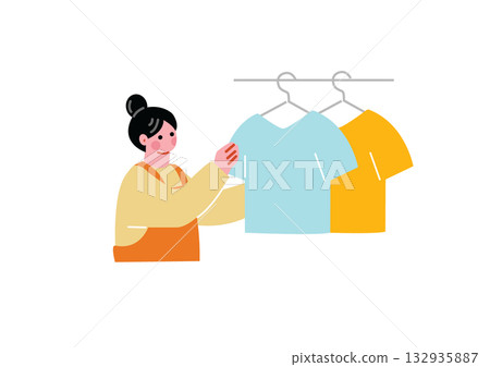 A woman hanging up the laundry A woman hanging up the laundry 132935887