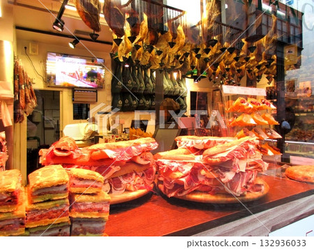 Prosciutto and salami for sale at a Spanish market Prosciutto and salami for sale at a Spanish market 132936033