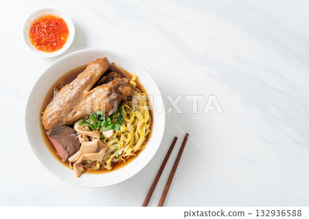 egg noodles with stewed and braised duck in brown soup egg noodles with stewed and braised duck in brown soup 132936588
