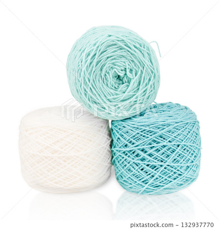 White and green knitting yarn isolated on white background White and green knitting yarn isolated on white background 132937770