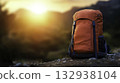 Vibrant Orange Backpack Against Scenic Sunset in Nature Landscape 132938104