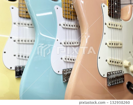 Pastel-colored electric guitars lined up Pastel-colored electric guitars lined up 132938260