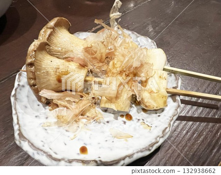 Delicious charcoal grilled king oyster mushroom skewers Delicious charcoal grilled king oyster mushroom skewers 132938662