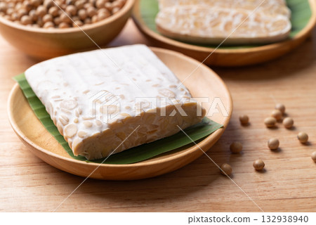 Tempeh (fermented soybeans), Traditional Indonesian food, Healthy vegan and plant based ingredients Tempeh (fermented soybeans), Traditional Indonesian food, Healthy vegan and plant based ingredients 132938940