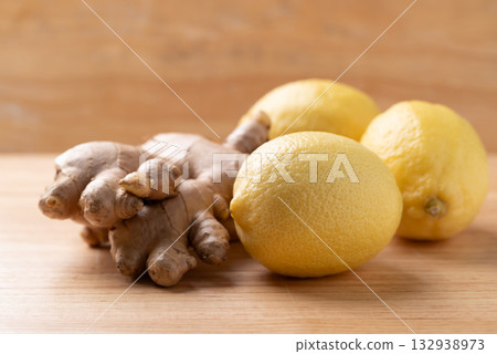 Fresh lemon and ginger on wooden background 132938973