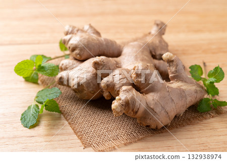 Fresh ginger with mint leaf on wooden background 132938974