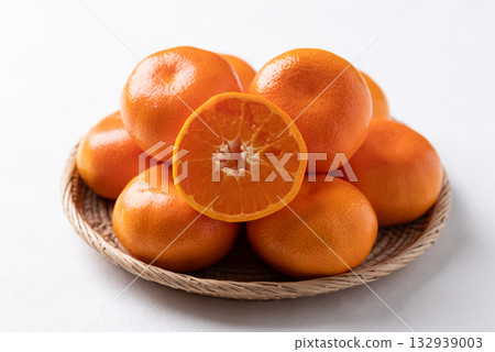 Mandarin orange fruit in basket on white background Mandarin orange fruit in basket on white background 132939003