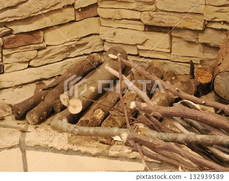 Firewood next to the fireplace Firewood next to the fireplace 132939589