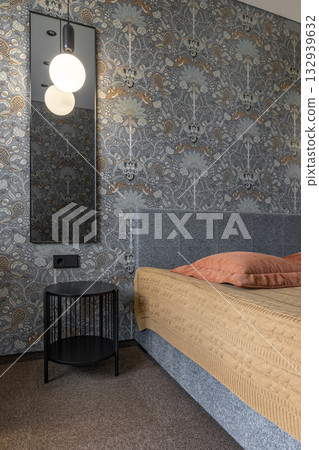 Cozy Bedroom Corner with Bedside Table and Decorative Wallpaper Cozy Bedroom Corner with Bedside Table and Decorative Wallpaper 132939632