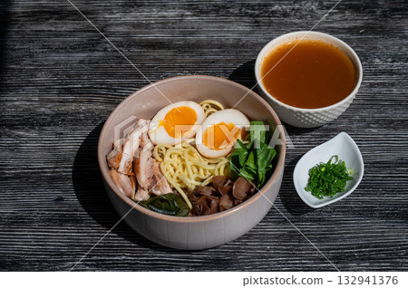Ramen soup in a cafe. Broth separately. Ramen soup in a cafe. Broth separately. 132941376