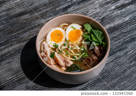 Ramen soup in cafe on wooden table.  132941560