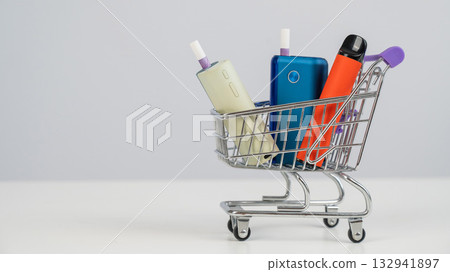 Electronic cigarette and disposable vape in a shopping cart. Tobacco heating systems and vaporizer. 132941897