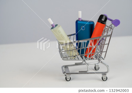 Electronic cigarette and disposable vape in a shopping cart. Tobacco heating systems and vaporizer. Electronic cigarette and disposable vape in a shopping cart. Tobacco heating systems and vaporizer. 132942003