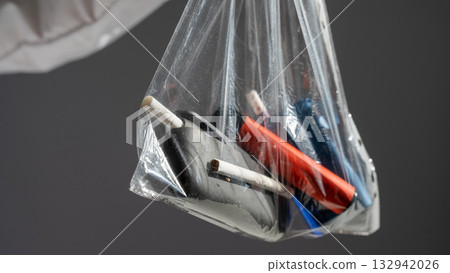 Electronic cigarettes and disposable vapes in a bag.  132942026