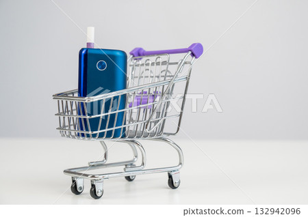 Electronic cigarette in a shopping cart. Tobacco heating system. Electronic cigarette in a shopping cart. Tobacco heating system. 132942096