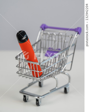 Disposable vape in a customer's cart. Disposable vape in a customer's cart. 132942204