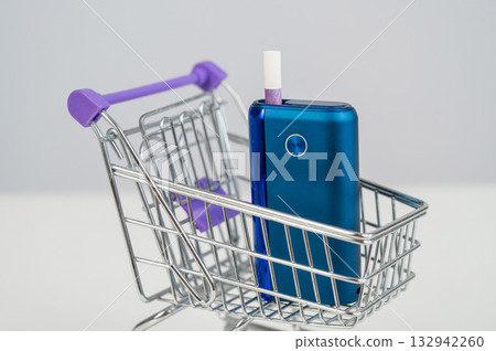 Electronic cigarette in a shopping cart. Tobacco heating system. Electronic cigarette in a shopping cart. Tobacco heating system. 132942260