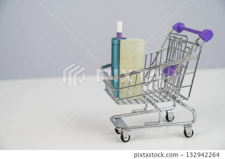Electronic cigarette in a shopping cart. Tobacco heating system. Electronic cigarette in a shopping cart. Tobacco heating system. 132942264