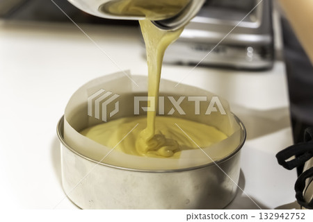 Making a cake_Pour the batter into the mold Making a cake_Pour the batter into the mold 132942752