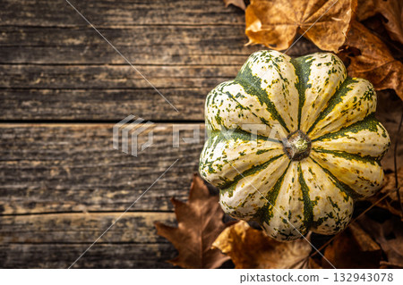 Sweet dumpling pumpkin on wooden table. Top view. 132943078
