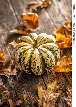 Sweet dumpling pumpkin on wooden table. 132943082