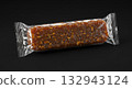 Energy Bar in Transparent Packaging on Black Background, Close-up Shot 132943124