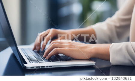 close-up of  hands of businessman pressing on laptop keyboard freelancer technology finance and business 132943651
