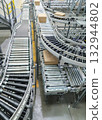 packing line in a logistics warehouse. conveyor belt in a modern production line 132944802