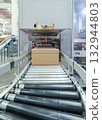 packing line in a logistics warehouse. conveyor belt in a modern production line 132944803