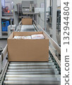 packing line in a logistics warehouse. conveyor belt in a modern production line 132944804