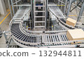 packing line in a logistics warehouse. conveyor belt in a modern production line 132944811