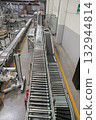 packing line in a logistics warehouse. conveyor belt in a modern production line 132944814