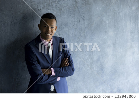 A foreign man wearing a suit and thinking A foreign man wearing a suit and thinking 132945806